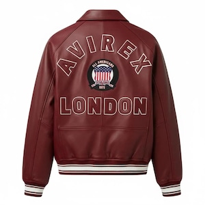 May include: A dark red leather varsity jacket featuring the text AVIREX in an arc above a circular patch with an American flag and the text ALL AMERICANS ESTABLISHED 1975. The word LONDON is printed below the patch. The jacket has striped ribbed cuffs.