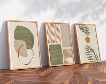 May include: Three framed abstract art prints. The prints feature earthy tones of green, beige, and brown. The first print has organic shapes, the second has vertical lines and geometric shapes, and the third has a sun and leaf design.