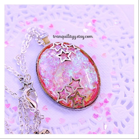 Pink glitter circle charm necklace.