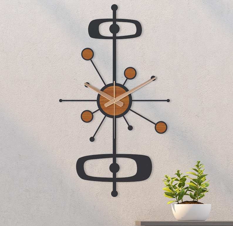 May include: A mid-century modern wall clock with a black frame and wooden accents. The clock features a circular face with wooden hands and a starburst design. The clock's dimensions are approximately 30 inches in height.