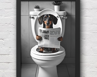 May include: Framed print of a dachshund dog on a toilet, reading a newspaper. The dog is black and brown, with the newspaper text reading "Poolest house toilet seat and where dogs can". The background includes a white toilet, grey tiles, and small potted plants.