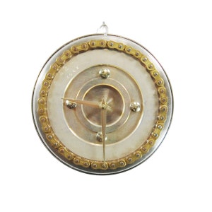 May include: A silver and gold clock with a chain link border. The clock face has a silver background with a gold inner circle and four gold accents. The clock hands are gold.