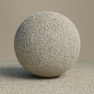 May include: A spherical object with a rough, textured surface made of small, light grey and beige pebbles. The sphere sits on a matching surface, with a neutral background.