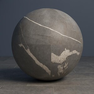 May include: A large, spherical object with a textured, grey surface. A prominent white vein-like pattern runs across the sphere, with a lighter, mottled area on one side. The object appears to be made of stone or a similar material.