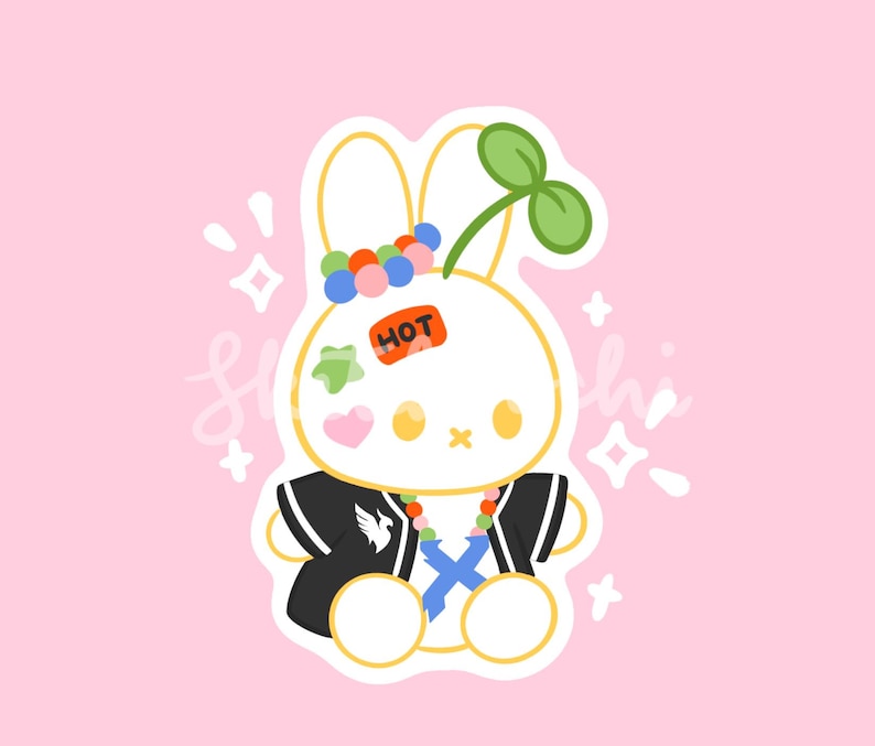 May include: A cartoon illustration of a white bunny with a black jacket, colorful accessories, and a green sprout on its head. The bunny has a "HOT" sticker and a pink heart. The background is pink.