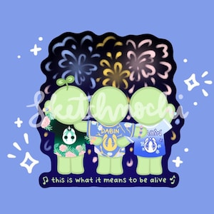 May include: Illustration of three green figures in colorful shirts, arms around each other, with fireworks in the background. The shirts have floral and geometric designs. Text reads "this is what it means to be alive."