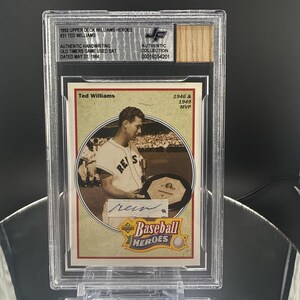 May include: A graded Ted Williams baseball card from the 1992 Upper Deck Williams Heroes series. The card features a sepia-toned image of Williams in his Red Sox uniform, with his signature. The card is encased in a clear protective holder.