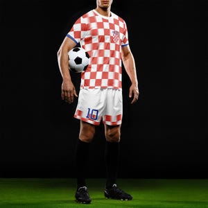 May include: A soccer player in a red and white checkered jersey and white shorts with the number 10. The jersey has blue trim and a Croatian flag patch. The player is holding a black and white soccer ball, wearing black socks and cleats.