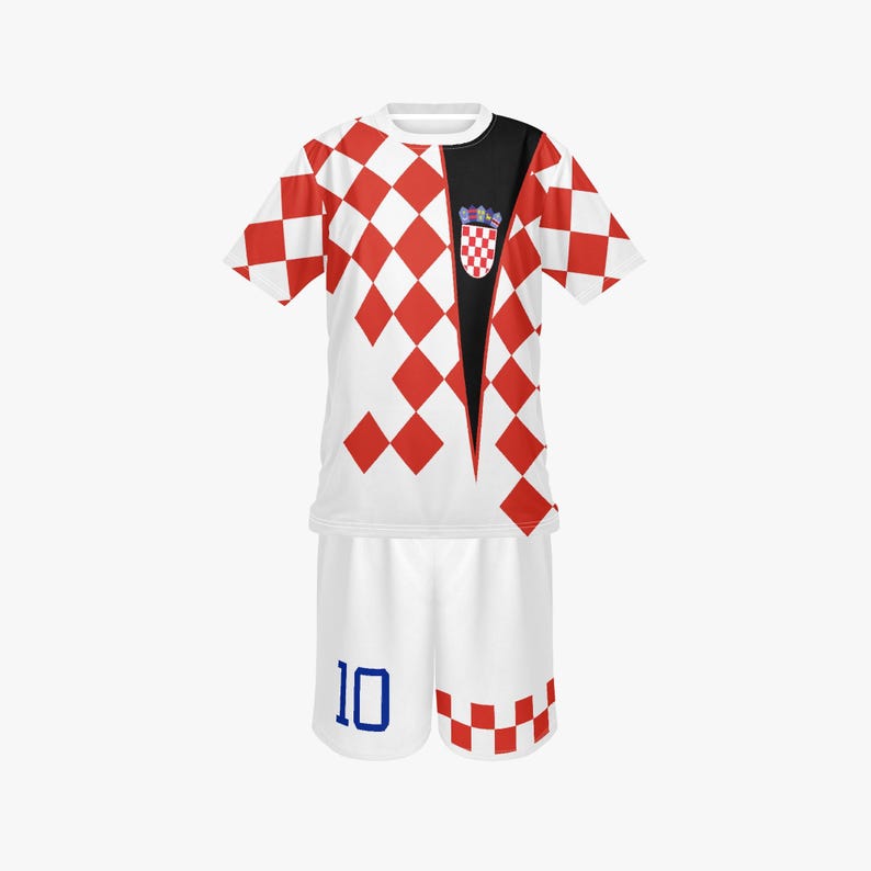 May include: A white and red checkered soccer uniform with a Croatian crest. The jersey has a black panel and the shorts have the number 10 in blue. The uniform is a complete set.