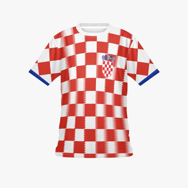 May include: A white t-shirt with a red and white checkered pattern. The shirt has a small pocket with a Croatian coat of arms. The sleeves have blue trim.