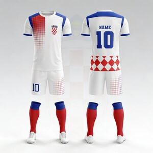 May include: A complete white soccer uniform with blue and red accents. The jersey features a red and white checkered design on the front and a blue collar. The shorts and socks are also included, along with white cleats. The number 10 is on the shorts and jersey.