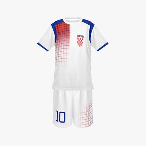 May include: White soccer uniform with blue and red accents. The jersey has a red and blue gradient design on the shoulder and a Croatian coat of arms. The shorts have the number 10 in blue.