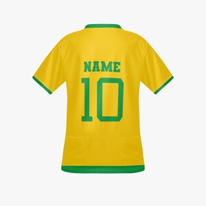 May include: A yellow soccer jersey with green trim, the back displaying the number 10 and the word "NAME" in green block letters. The jersey has short sleeves and a crew neck.