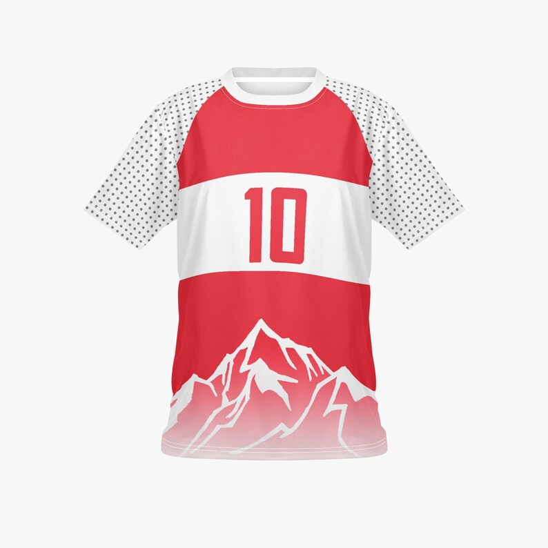 May include: Red and white athletic jersey with the number 10 in red. The jersey features a white horizontal stripe across the chest and a mountain graphic at the bottom. The sleeves are white with a dotted pattern.