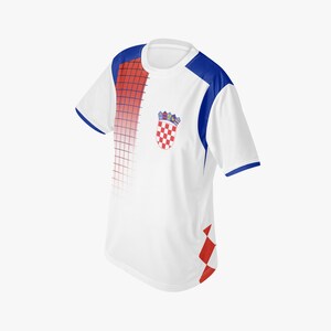 May include: White athletic jersey with blue shoulder accents and trim. The jersey features a red and white checkered emblem on the chest, and a red and white checkered design on the lower right side. A red grid pattern fades into the white fabric.