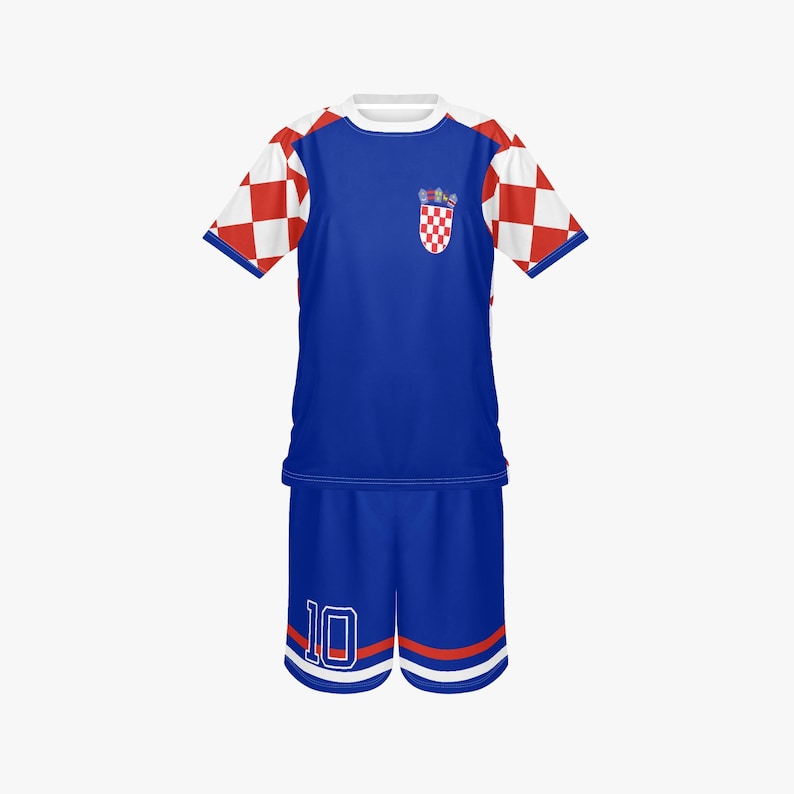 May include: A blue soccer uniform with white and red checkered sleeves. The shirt has a Croatian coat of arms on the chest and a white collar. The shorts are blue with the number 10 in white.