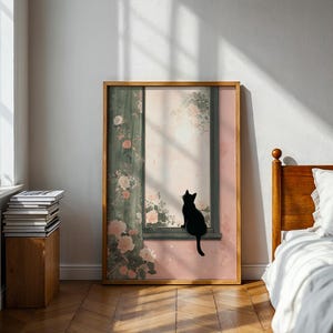 May include: A framed art print featuring a black cat silhouette perched on a window ledge. The artwork has a soft, pastel color palette with floral and botanical elements. The frame is a warm, natural wood tone, complementing the room's decor.