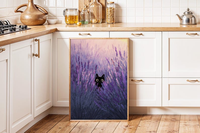 May include: A framed print depicting a black cat amongst purple lavender. The artwork has a soft, painterly style with a warm, golden frame. The background is a gradient of pink and yellow, creating a serene atmosphere.