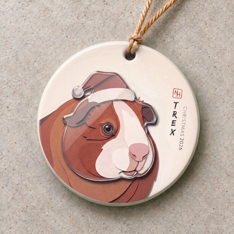 Personalized guinea pig Christmas ornament with a 3.5 mm matte ceramic base and a separate 3 mm clear acrylic portrait-and-Santa-hat layer.