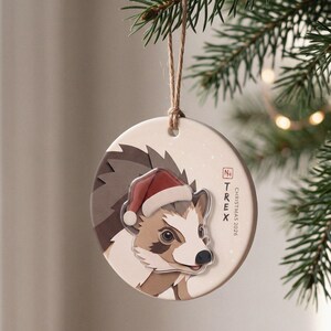 Personalized hedgehog Christmas ornament displayed in a calm, warmly lit holiday setting with the portrait clearly visible.