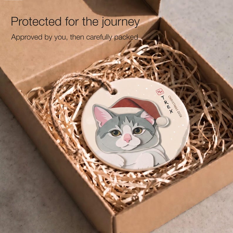 Personalized cat Christmas ornament protected inside a kraft box with paper filling, ready for careful shipping after design approval.