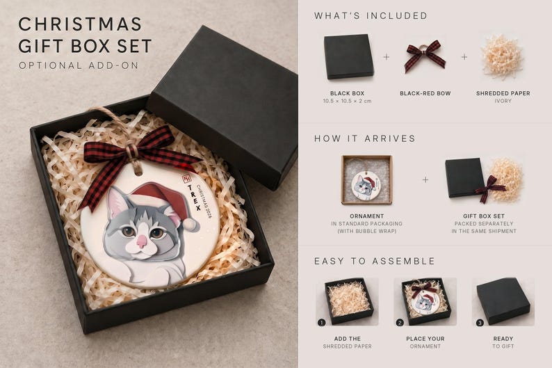 May include: A Christmas gift box set containing a round ceramic ornament with a gray and white cat illustration wearing a red Santa hat, a black and red plaid ribbon, and ivory shredded paper filler, with assembly instructions.