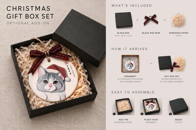 Puede incluir: Un set de regalo navide&ntilde;o que incluye un adorno de cer&aacute;mica redondo con la ilustraci&oacute;n de un gato gris y blanco con gorro de Pap&aacute; Noel rojo, una cinta de cuadros negra y roja y papel triturado marfil, con instrucciones.