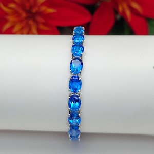 Natural Blue Topaz Tennis Bracelet | 925 Sterling Silver | 8×6mm AAAA Oval Cut | Elegant Birthstone Jewelry