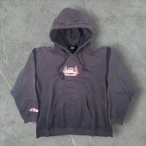 May include: A dark charcoal gray hooded sweatshirt featuring a front kangaroo pocket and long sleeves. The chest displays a graphic with red flames and the text "No Fear Super Energy Supplement." A small red and white logo is on the right sleeve.