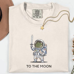To The Moon Astronaut Frog Graphic Shirt, Funny Space Exploration Tee, NASA Artemis 2 Moon 2026 Humor Gift For Astronomy And Animal Lover image 5