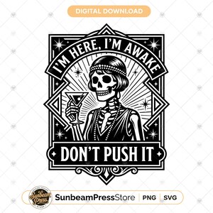 May include: A black and white digital graphic featuring a skeleton wearing a beaded headband and necklace, holding a martini glass. The text reads I'M HERE, I'M AWAKE and DON'T PUSH IT, framed within an art deco style border with star accents.