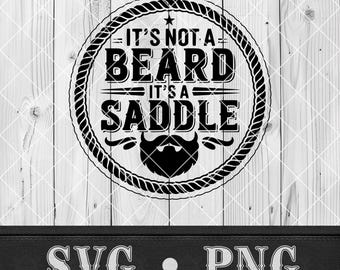 May include: Black and white graphic design on a wooden background. The design features the text "IT'S NOT A BEARD IT'S A SADDLE" inside a rope circle, with a stylized beard below. The bottom of the image has the text "SVG • PNG".