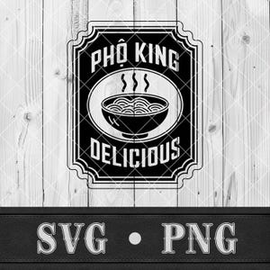 May include: Black and white graphic design featuring the text "PHO KING DELICIOUS" with a bowl of noodles. The design is in a rectangular frame with a decorative border, set against a wood-grain background. Below the design are the letters "SVG • PNG".