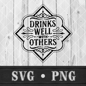 May include: Black and white graphic design with the text "DRINKS WELL WITH OTHERS" inside a decorative diamond-shaped frame. The design is set against a light wood background. Below the design is the text "SVG • PNG".