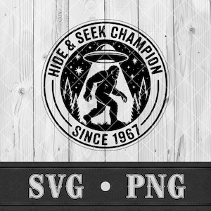 May include: Black and white graphic featuring a Bigfoot silhouette under a UFO, with the text "HIDE & SEEK CHAMPION SINCE 1967". The design includes stars, trees, and a circular border, perfect for apparel or stickers.