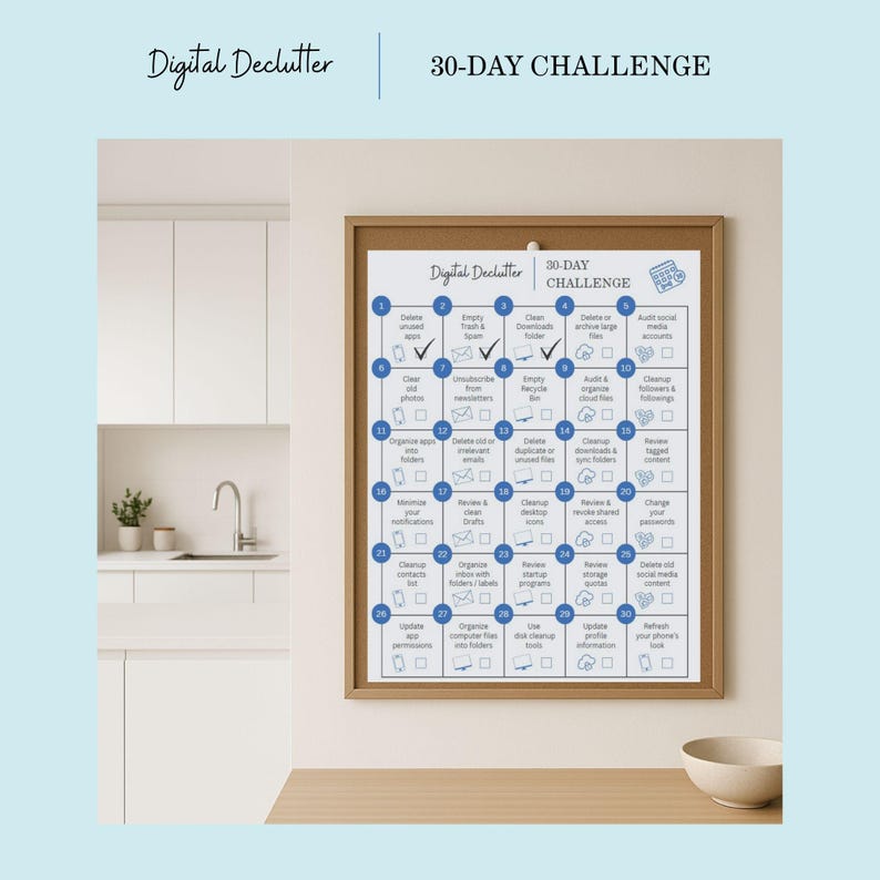 May include: A framed print titled "Digital Declutter 30-Day Challenge" hangs on a wall. The print features a grid with numbered tasks for digital organization, including deleting files and managing social media.