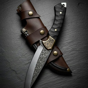 May include: A detailed close-up of a hunting knife with a patterned blade and a black handle. The knife is in a brown leather sheath with brass-colored rivets. The blade has an ornate design, and the handle has a textured pattern.