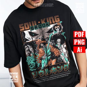 Puede incluir: Camiseta negra con un diseño gráfico con el texto "SOUL KING BROOK" en naranja y blanco. El diseño incluye ilustraciones de un personaje esqueleto tocando la guitarra, con texto japonés y una cita.