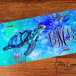 May include: A blue and green watercolor-style sea turtle with a blue monogram "BML" on a blue and white background with bubbles. The background is reminiscent of an ocean scene.