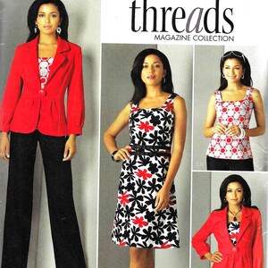 May include: A sewing pattern for a red jacket, a black and white floral dress, and a red and white polka dot top. The pattern is from Simplicity Threads Magazine Collection and is number 2703.