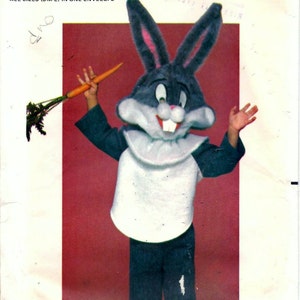 May include: A vintage sewing pattern for a Bugs Bunny costume. The pattern is for a one-size costume and includes all sizes (S-M-L) in one envelope. The pattern is from the Quick & Easy Butterick line and is officially licensed by Warner Bros. The pattern number is 6348.