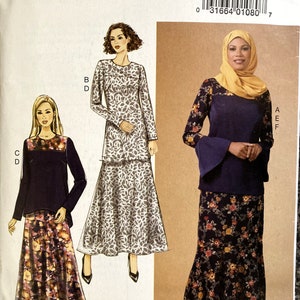 May include: A sewing pattern for a dress with a long skirt and a top with long sleeves. The pattern is from Butterick and the pattern number is R10038.