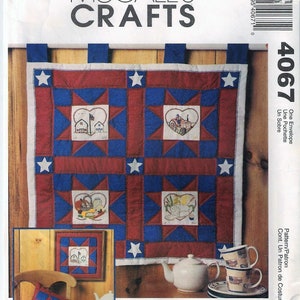 May include: A McCall's Crafts pattern for a quilted wall hanging with a patriotic theme. The pattern features a red, white, and blue color scheme with stars and hearts. The pattern is titled "Homeland Treasures" by Landa Anklam.