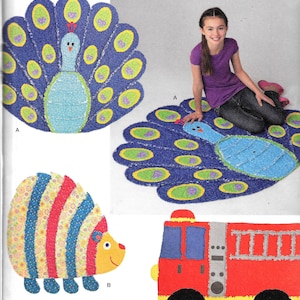 May include: A sewing pattern for making four different children's rugs. The rugs are a peacock, a hedgehog, a fire truck, and another peacock. The pattern is from Simplicity and is for one size. The pattern is designed by Longia Miller Design.