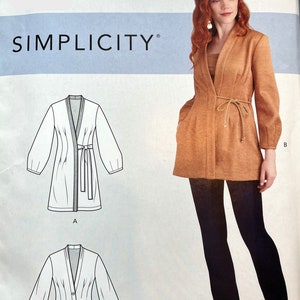 May include: A sewing pattern for a wrap jacket with long sleeves and a tie belt. The pattern is called Simplicity R10426. The pattern includes three different views: A, B, and C. View A is a short, fitted jacket with a tie belt. View B is a longer, more relaxed jacket with a tie belt. View C is a shorter, more fitted jacket with a tie belt.