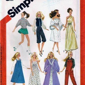 May include: A vintage Simplicity sewing pattern for doll clothes. The pattern number is 6369 and the price is $3.00. The pattern includes seven different outfits for a doll, including a jumpsuit, a dress, a nightgown, a robe, and a pair of overalls.