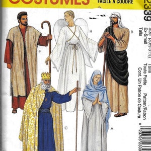 May include: A sewing pattern for a nativity scene costume set. The pattern includes four costumes: a king, a shepherd, an angel, and Mary. The pattern is for sizes 30 1/2 to 31 1/2 inches. The pattern is called "Easy to Sew" and is in French and English.