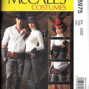 May include: A sewing pattern for three different costumes. The pattern is for a man's costume with a top hat, a woman's costume with a top hat, and a woman's costume with a red top hat. The pattern is from McCall's Costumes and the pattern number is M6975.