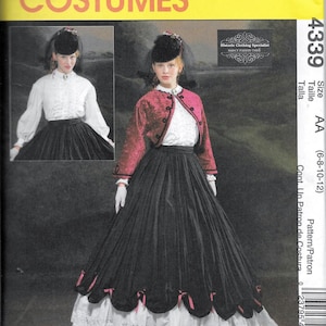 May include: A vintage sewing pattern for a black and white dress with a red jacket. The pattern is for sizes 6-8-10-12 and is from McCall's Costumes. The pattern is titled "Historic Clothing Specialist Nancy Farris There".