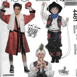 May include: McCall's sewing pattern for children's costumes, including a boxer in a red robe, a cowboy with a rope, and a sheik with a turban. The pattern includes the text "Sports News" and "Costumes".